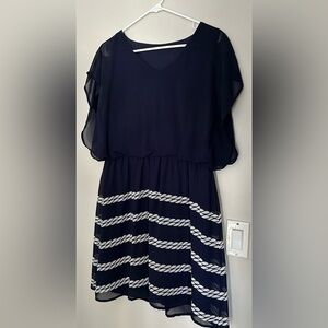 Nautical navy and white chiffon dress with gathered waist and flutter sleeves.L
